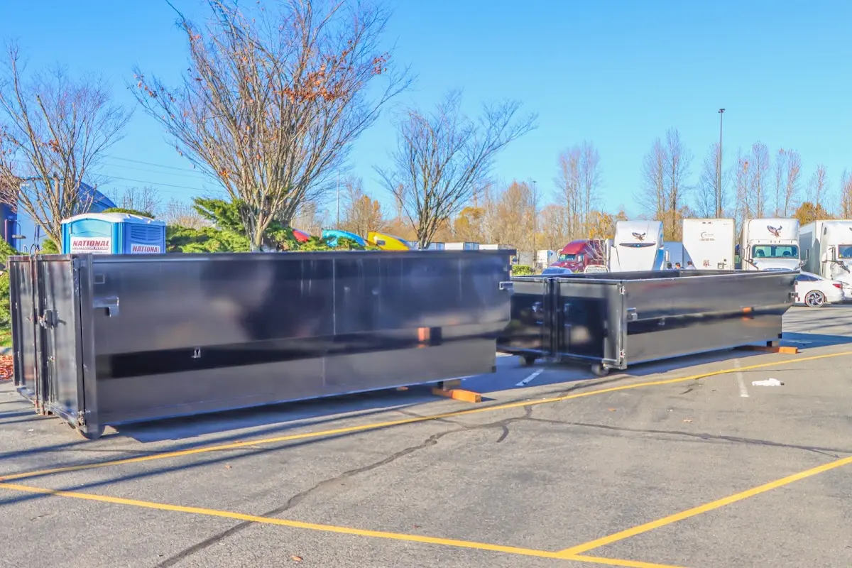 Professional dumpster rental service with roll-off container on residential driveway in Burkburnett
